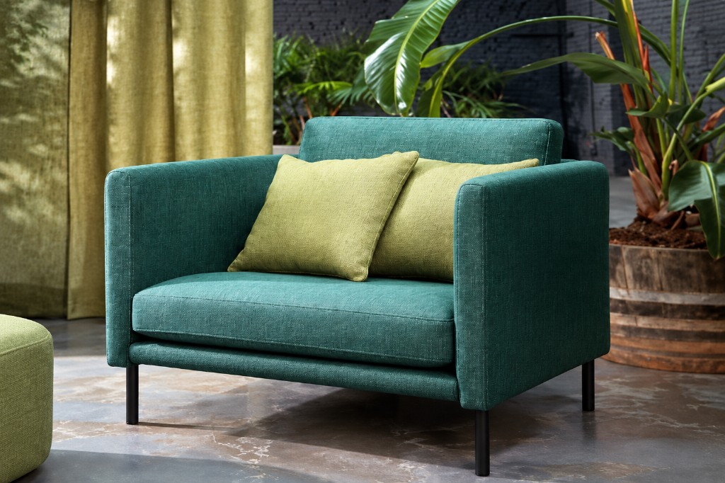 Teal Artem armchair with green pillows