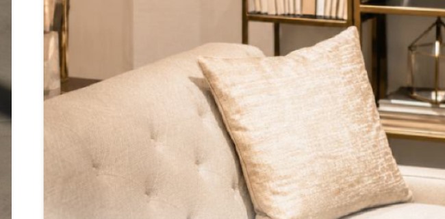 Tufted sofa with gold textured pillow