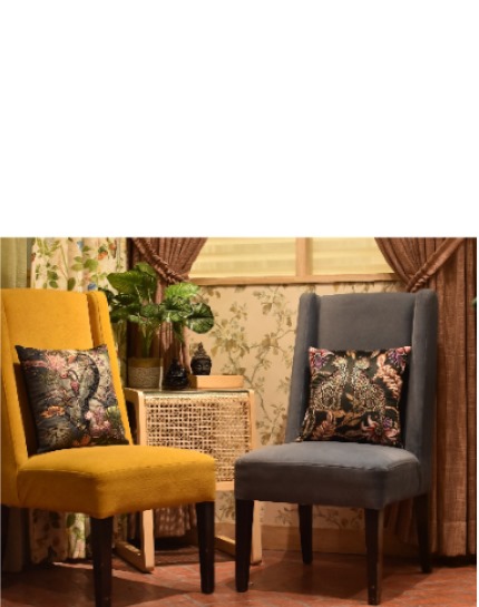 Yellow and grey armchairs with patterned cushions